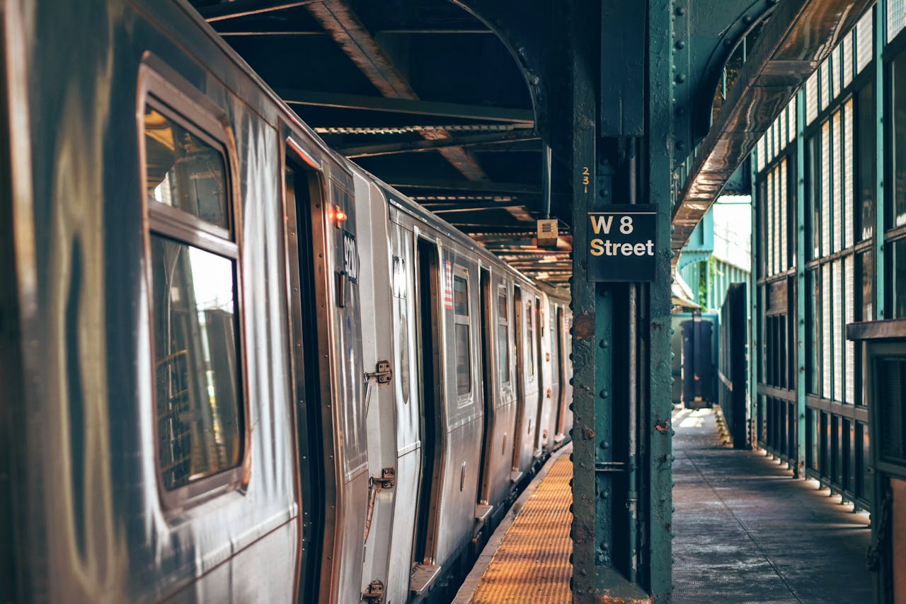 A modern train at a city subway station platform, reflecting urban transportation